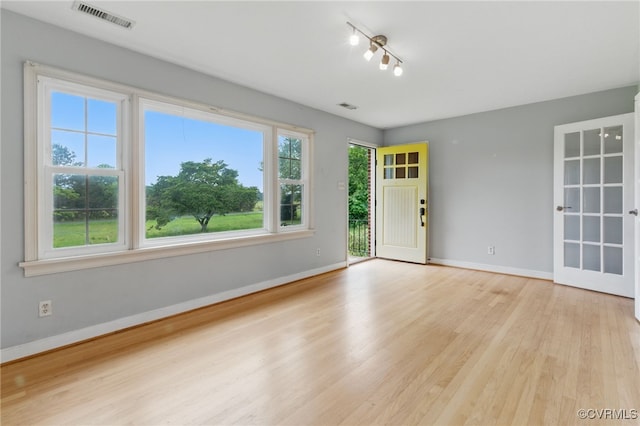 11440 Bienvenue Rd, Rockville, VA 23146 - empty room featuring wood finished floors, healthy amount of natural light, and baseboards