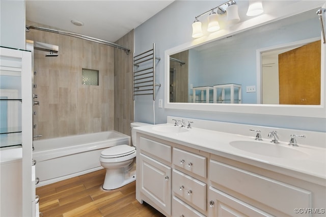 11440 Bienvenue Rd, Rockville, VA 23146 - bathroom featuring toilet, double vanity, shower / bath combination, and wood finished floors