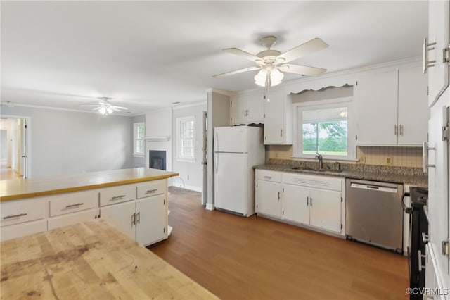 11440 Bienvenue Rd, Rockville, VA 23146 - kitchen featuring stainless steel dishwasher, freestanding refrigerator, ceiling fan, a sink, and ornamental molding