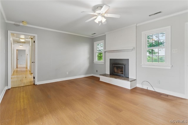 11440 Bienvenue Rd, Rockville, VA 23146 - unfurnished living room featuring a ceiling fan, wood finished floors, baseboards, ornamental molding, and a brick fireplace