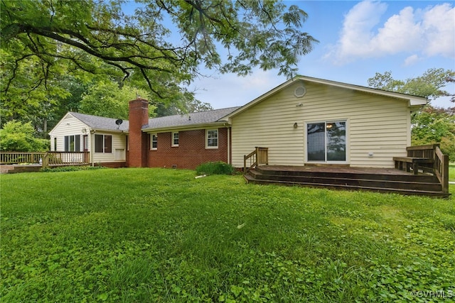 11440 Bienvenue Rd, Rockville, VA 23146 - back of property featuring a wooden deck, a chimney, a yard, and brick siding