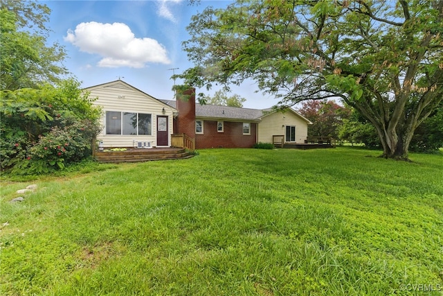 11440 Bienvenue Rd, Rockville, VA 23146 - rear view of property featuring a chimney, a lawn, and brick siding