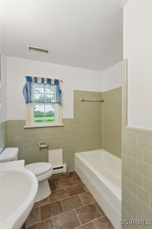 11440 Bienvenue Rd, Rockville, VA 23146 - full bath featuring tile walls, toilet, a baseboard radiator, a wainscoted wall, and a sink