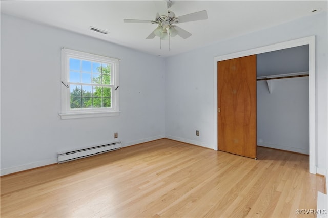 11440 Bienvenue Rd, Rockville, VA 23146 - unfurnished bedroom with baseboard heating, wood finished floors, a closet, and baseboards
