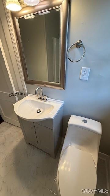 9014 Weldon Dr, Henrico, VA 23229 - bathroom featuring vanity, marble look tiles, and toilet