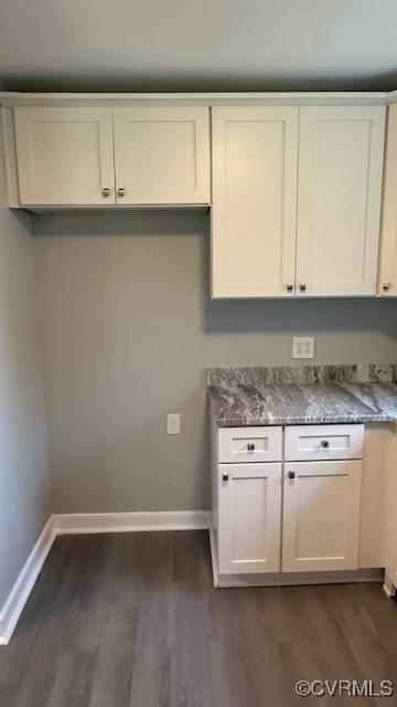 9014 Weldon Dr, Henrico, VA 23229 - kitchen featuring baseboards, dark wood-type flooring, and stone counters
