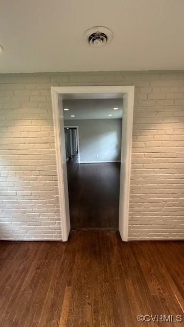 9014 Weldon Dr, Henrico, VA 23229 - corridor featuring brick wall and dark wood finished floors