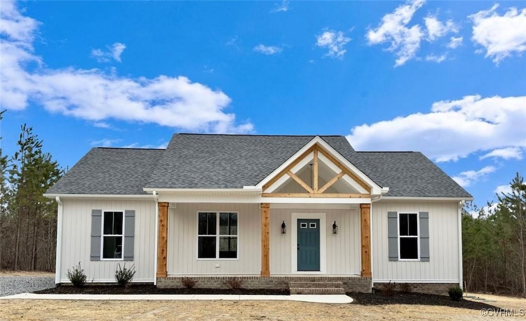 1201 Lewiston Plank Rd, Burkeville, VA 23922 - modern farmhouse featuring covered porch and roof with shingles