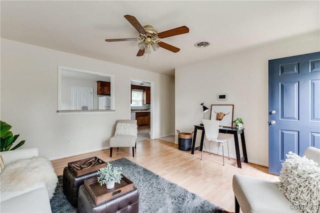 3307 Carlisle Ave, Hopewell, VA 23860 - living room featuring a ceiling fan, wood finished floors, and baseboards