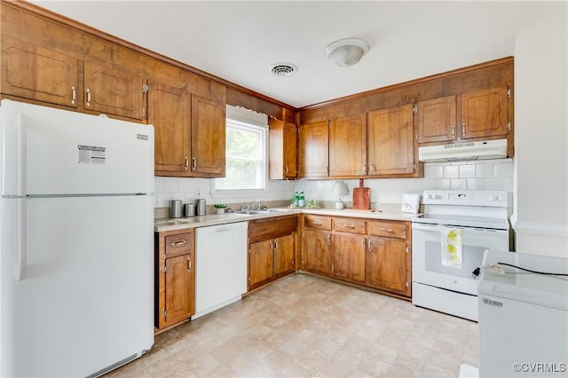 3307 Carlisle Ave, Hopewell, VA 23860 - kitchen featuring white appliances, under cabinet range hood, and brown cabinetry