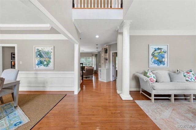 13212 Railey Hill Dr, Midlothian, VA 23114 - entryway with ornate columns, crown molding, light wood-style flooring, a wainscoted wall, and recessed lighting