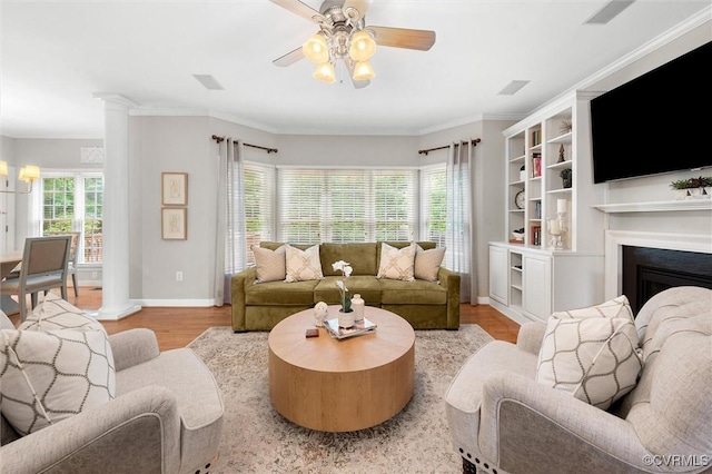 13212 Railey Hill Dr, Midlothian, VA 23114 - living room featuring baseboards, wood finished floors, a ceiling fan, a fireplace, and crown molding