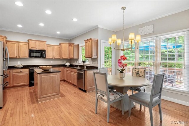 13212 Railey Hill Dr, Midlothian, VA 23114 - kitchen featuring black appliances, ornamental molding, a kitchen island, a chandelier, and plenty of natural light