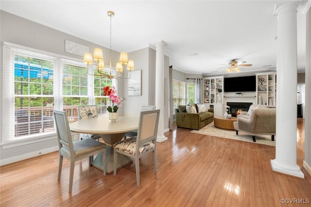 13212 Railey Hill Dr, Midlothian, VA 23114 - dining area with decorative columns, crown molding, a ceiling fan, light wood-style floors, and baseboards