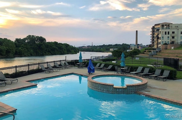 251 Rocketts Way Unit 210, Henrico, VA 23231 - view of swimming pool with a pool with connected hot tub, a patio, and a water view