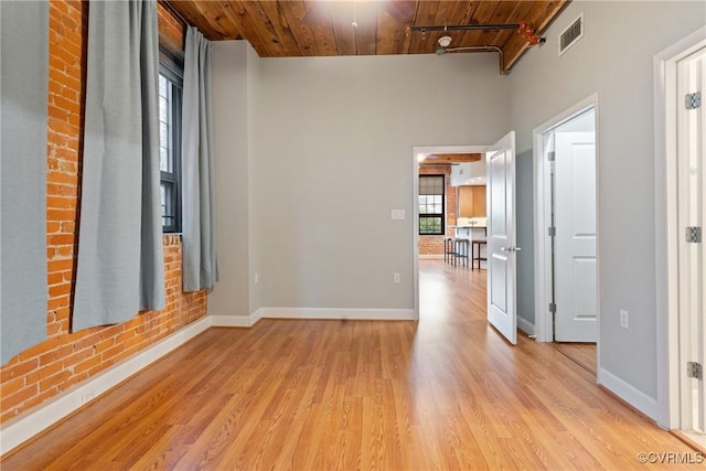 251 Rocketts Way Unit 210, Henrico, VA 23231 - unfurnished room featuring wood ceiling, light wood-style flooring, baseboards, and a high ceiling