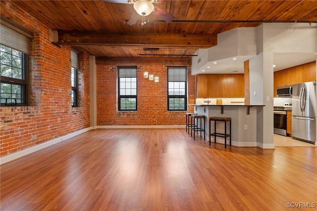 251 Rocketts Way Unit 210, Henrico, VA 23231 - living area featuring wood ceiling with exposed beams, light wood finished floors, baseboards, brick wall, and a ceiling fan