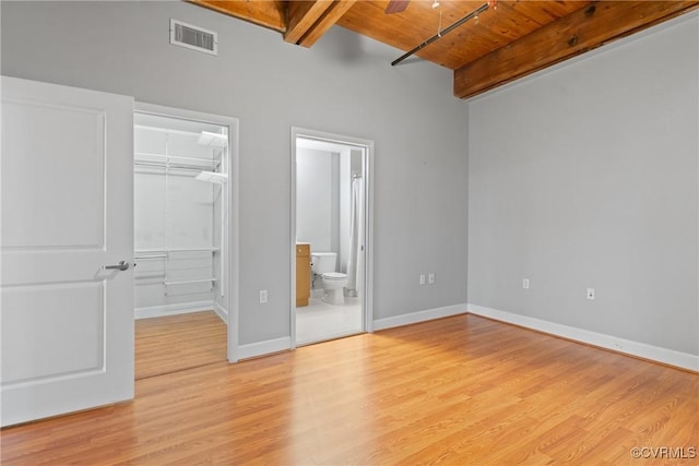 251 Rocketts Way Unit 210, Henrico, VA 23231 - unfurnished bedroom with wooden ceiling with exposed beams, a walk in closet, a closet, light wood-style floors, and baseboards