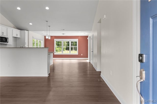 15631 Corte Castle Ter, Chesterfield, VA 23838 - kitchen with stainless steel microwave, dark wood-style floors, white cabinetry, open floor plan, and recessed lighting