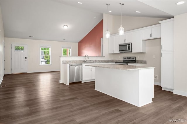 15631 Corte Castle Ter, Chesterfield, VA 23838 - kitchen with stainless steel appliances, white cabinetry, a kitchen island, a peninsula, and decorative light fixtures