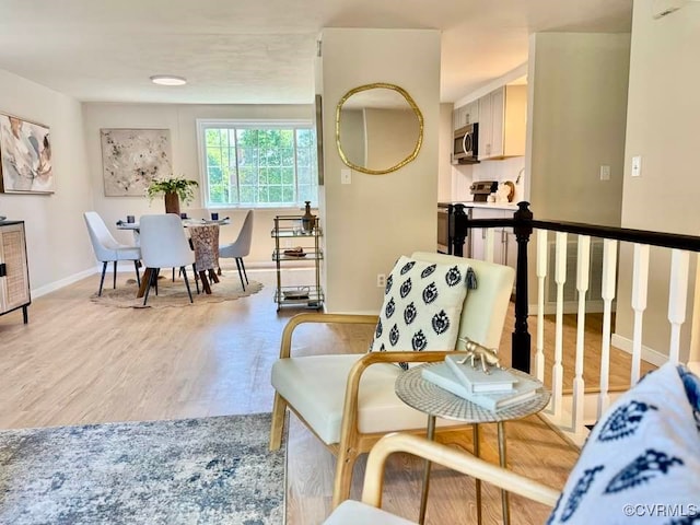 7534 Hollyleaf Ct, Chesterfield, VA 23234 - living room featuring light wood-type flooring and baseboards