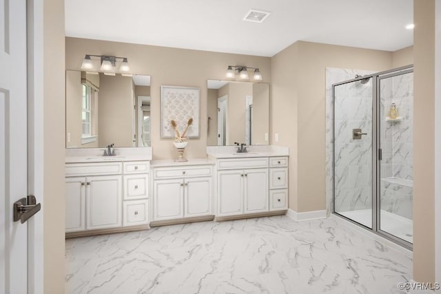 8613 Mckibben Dr, Chesterfield, VA 23838 - bathroom featuring marble finish floors, a marble finish shower, double vanity, and baseboards
