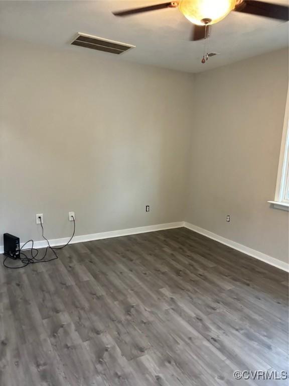 113 N Fern Ave, Highland Springs, VA 23075 - unfurnished room with baseboards and dark wood-type flooring