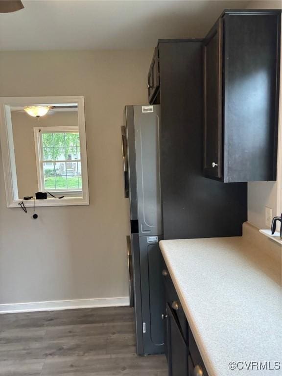 113 N Fern Ave, Highland Springs, VA 23075 - kitchen with freestanding refrigerator, light countertops, wood finished floors, and baseboards