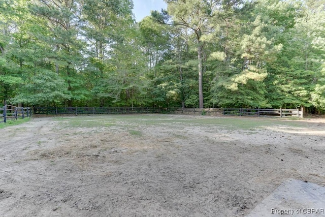 9361 Sheldon Ln, Gloucester, VA 23061 - view of yard featuring an outdoor riding arena and a forest view