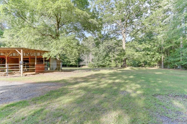 9361 Sheldon Ln, Gloucester, VA 23061 - view of yard featuring an outdoor structure and an exterior structure