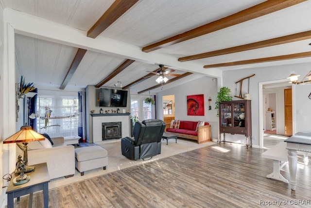 9361 Sheldon Ln, Gloucester, VA 23061 - living area with plenty of natural light, wood finished floors, and a fireplace