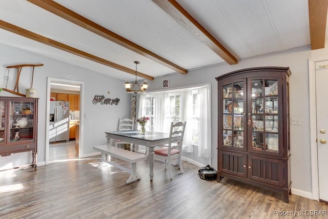 9361 Sheldon Ln, Gloucester, VA 23061 - dining room with a chandelier, light wood-type flooring, and baseboards