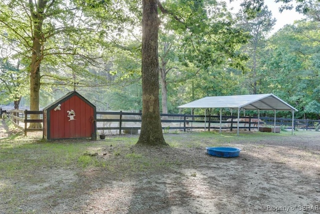 9361 Sheldon Ln, Gloucester, VA 23061 - view of yard with an outdoor structure and a detached carport