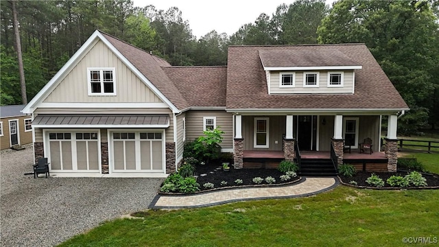 6420 Clayville Ln, Moseley, VA 23120 - craftsman-style house with board and batten siding, driveway, a front lawn, roof with shingles, and stone siding