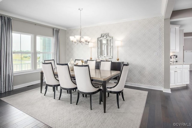 13006 Abercrombie Dr, Chesterfield, VA 23838 - dining area featuring wallpapered walls, baseboards, a chandelier, dark wood-style floors, and an accent wall