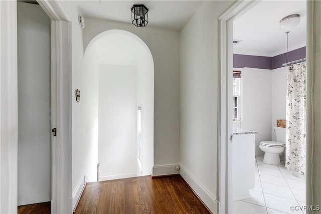 4318 Stuart Ave, Richmond, VA 23221 - corridor with arched walkways and wood finished floors