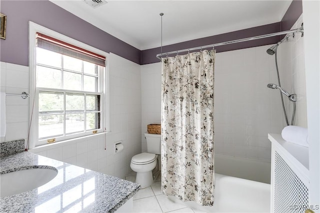4318 Stuart Ave, Richmond, VA 23221 - full bathroom featuring vanity, toilet, tile patterned flooring, and shower / tub combo