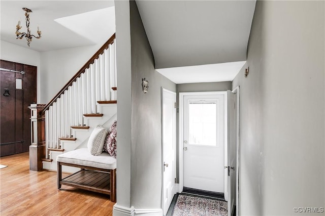 4318 Stuart Ave, Richmond, VA 23221 - entrance foyer with light wood-style floors and stairway