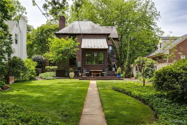 4318 Stuart Ave, Richmond, VA 23221 - rear view of property with a deck, board and batten siding, a chimney, and brick siding