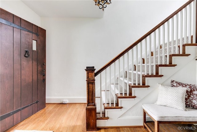 4318 Stuart Ave, Richmond, VA 23221 - entrance foyer with wood finished floors, stairway, and baseboards