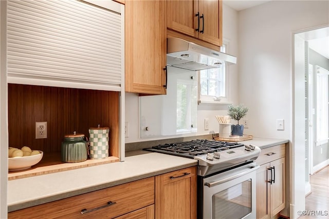 4318 Stuart Ave, Richmond, VA 23221 - kitchen featuring gas range, under cabinet range hood, and light countertops