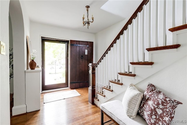 4318 Stuart Ave, Richmond, VA 23221 - entryway with stairs, light wood finished floors, and a chandelier
