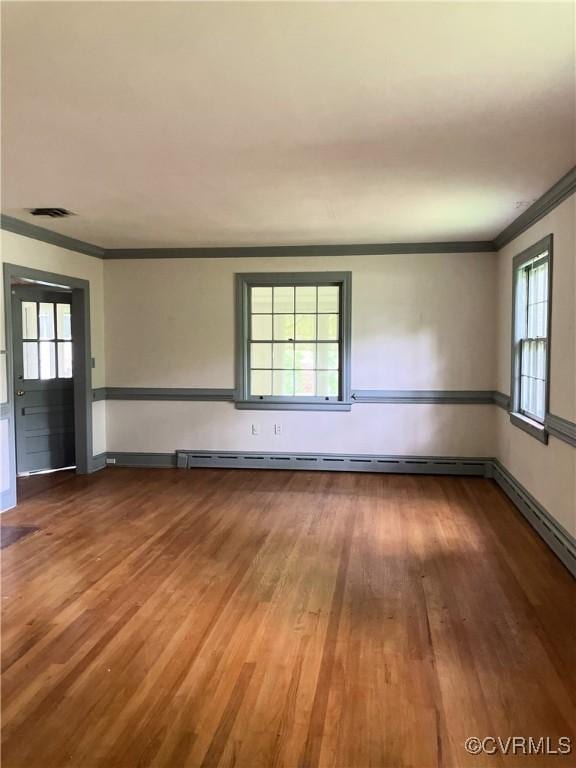 726 S Broad St, Kenbridge, VA 23944 - empty room with crown molding, wood finished floors, and baseboards