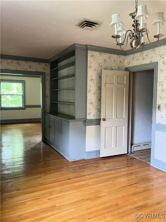 726 S Broad St, Kenbridge, VA 23944 - unfurnished dining area with wallpapered walls, baseboard heating, light wood-style floors, a chandelier, and crown molding