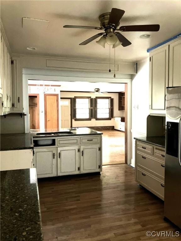 726 S Broad St, Kenbridge, VA 23944 - kitchen with stainless steel refrigerator with ice dispenser, ceiling fan, dark wood finished floors, cooktop, and ornamental molding