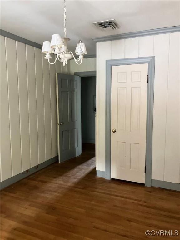 726 S Broad St, Kenbridge, VA 23944 - unfurnished dining area with a chandelier and dark wood-style flooring