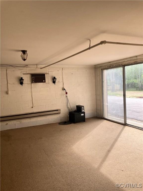 726 S Broad St, Kenbridge, VA 23944 - below grade area with concrete block wall, baseboard heating, and carpet flooring