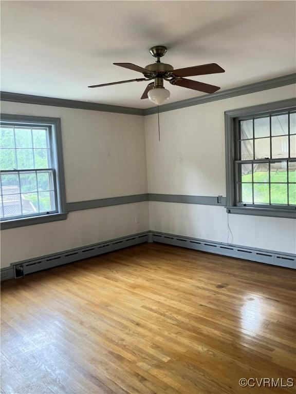 726 S Broad St, Kenbridge, VA 23944 - spare room with ornamental molding, wood finished floors, and a ceiling fan