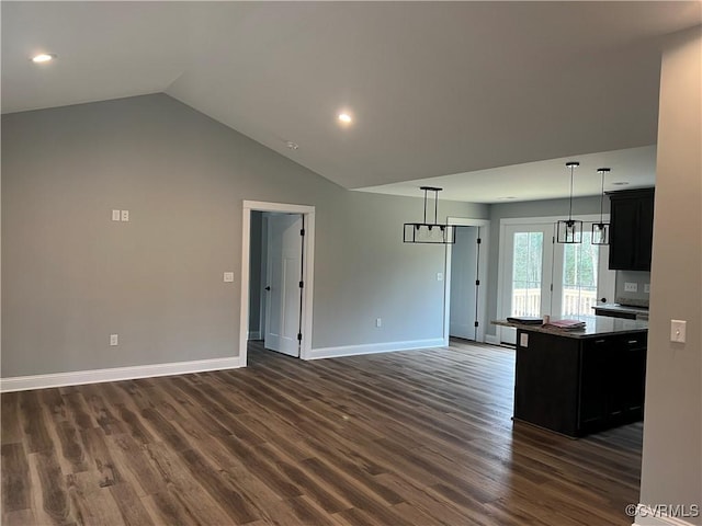 1 Johnville Rd, Dunnsville, VA 22454 - unfurnished living room featuring baseboards, dark wood-type flooring, a chandelier, vaulted ceiling, and recessed lighting