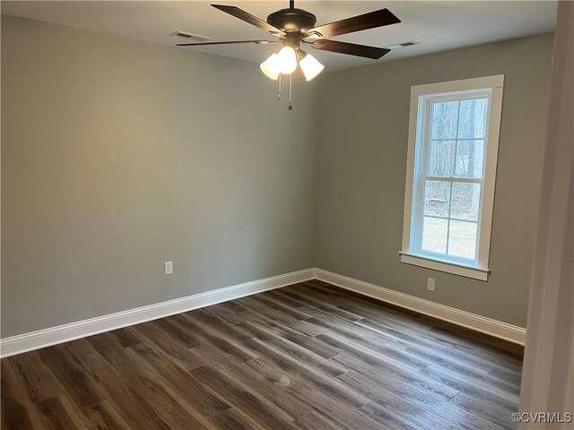 1 Johnville Rd, Dunnsville, VA 22454 - empty room featuring plenty of natural light, baseboards, dark wood-type flooring, and a ceiling fan